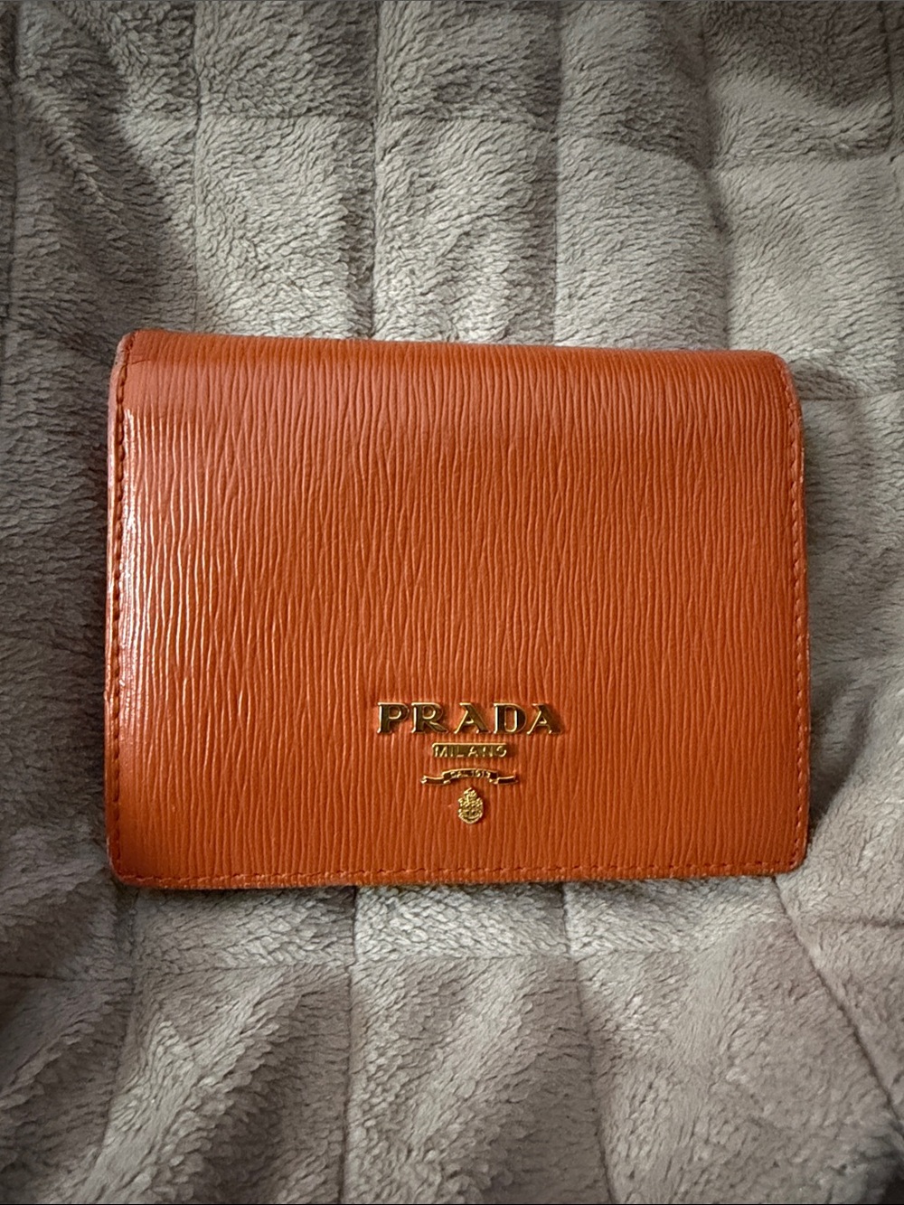 PRADA Unisex Orange Textured Compact Saffiano Leather Wallet with Gold Logo